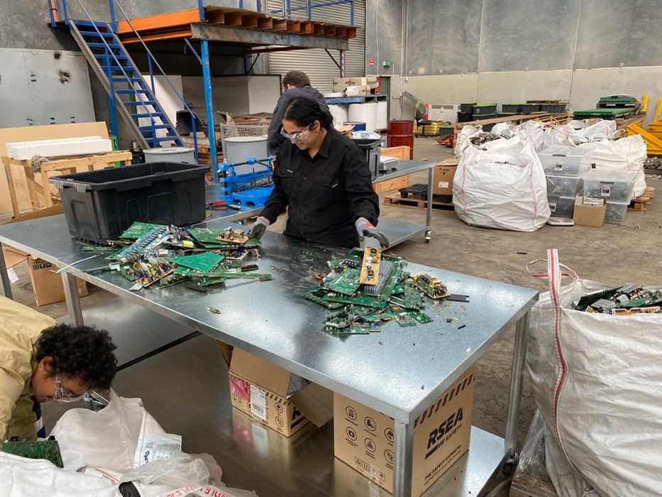 Dr Patel, Dr Lisboa and Dr Nicholls sort the electronic waste materials for the new method of processing and resource recovery. Photo: Flinders University