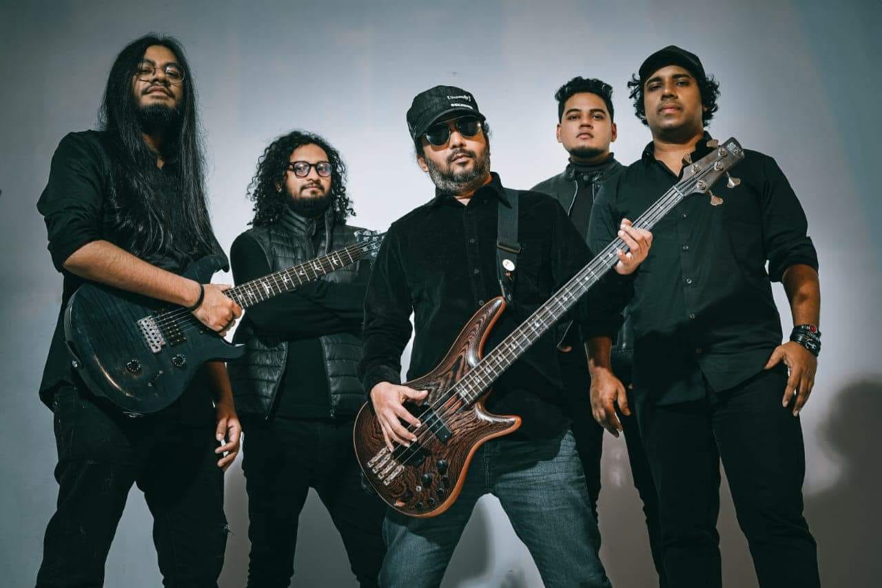 men dressed in black and holding musical instruments