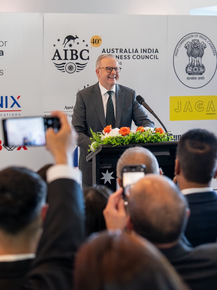 man in suit speaking