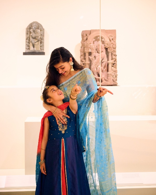 a woman and a young child in traditional indian wear