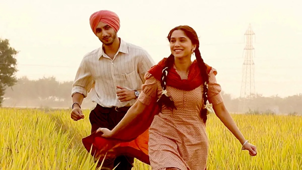 man and woman running in fields