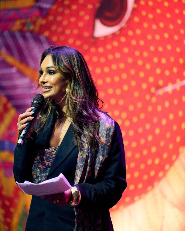 a woman speaking on the microphone