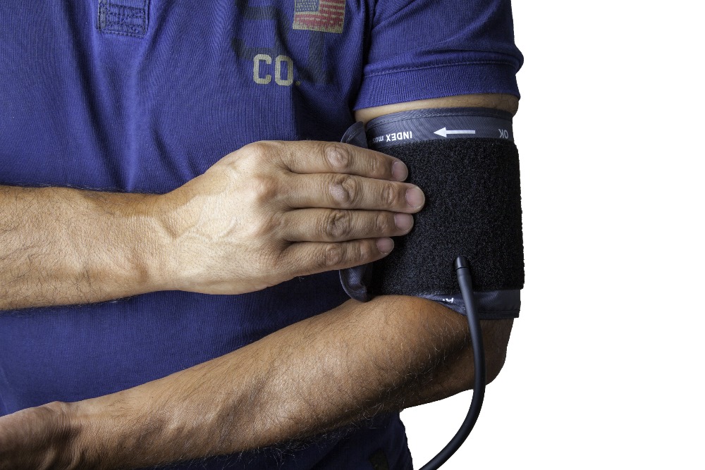 doctor with blood pressure equipment