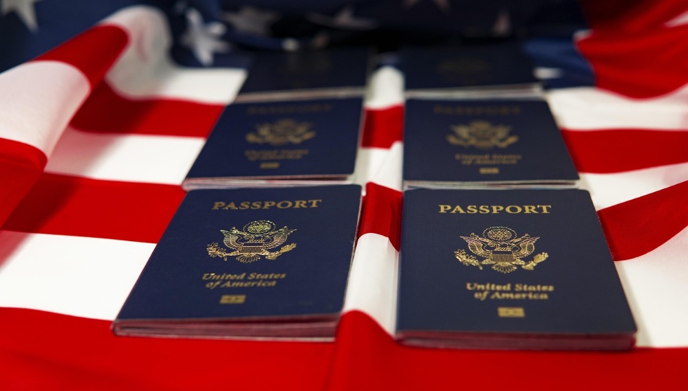US passports laid out on the US flag