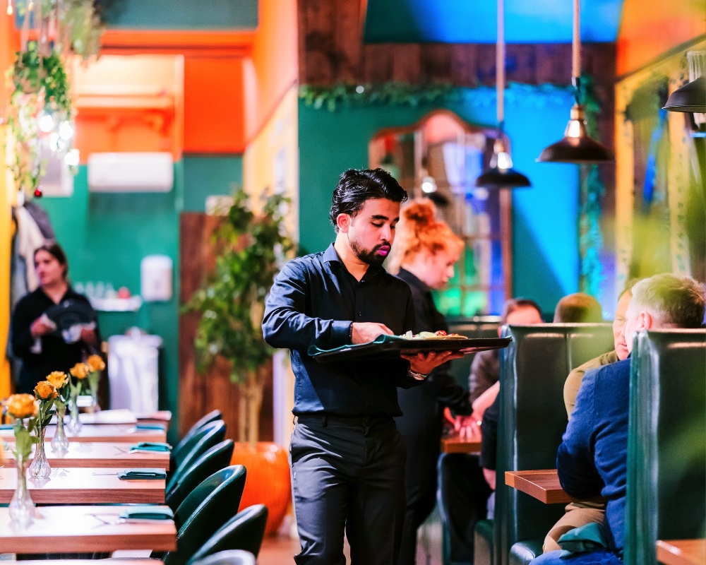 man serving in a restaurant